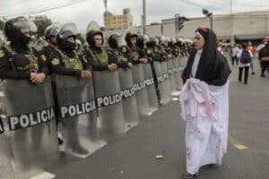 A demonstrator dressed as a nun