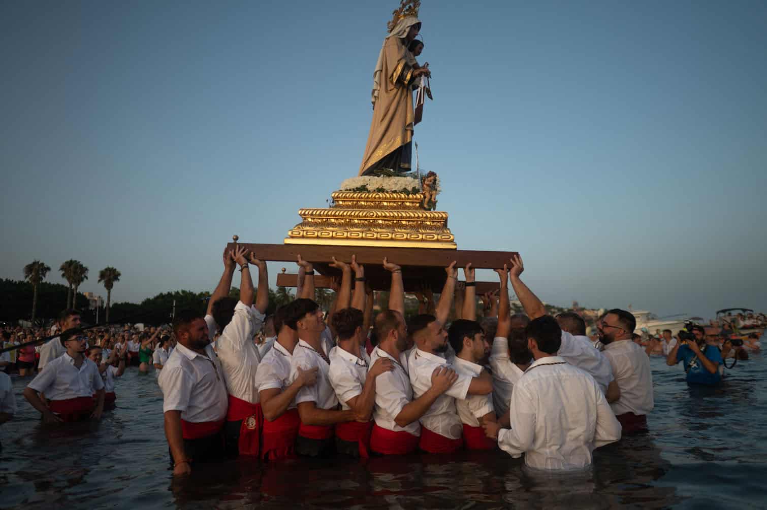 Penitents carry the statue of the 