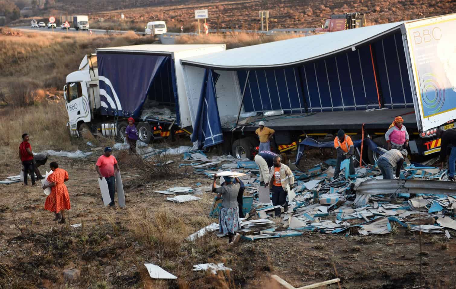 Crashed truck being looted