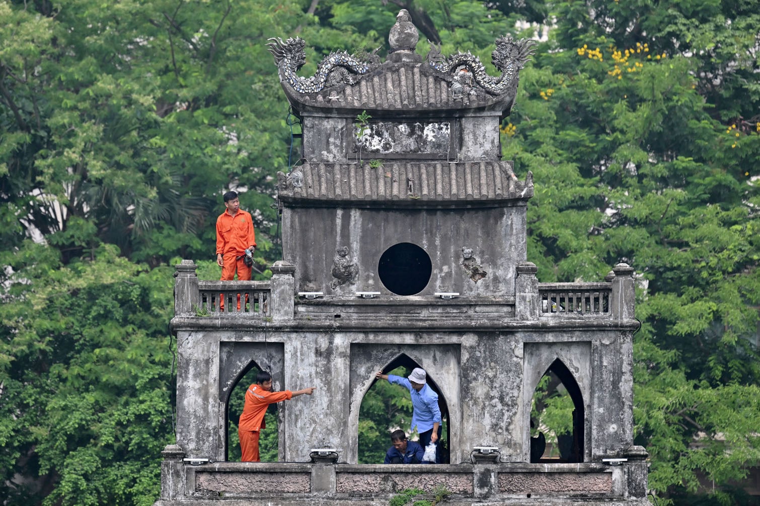 Workers renovate the "Thap Rua"