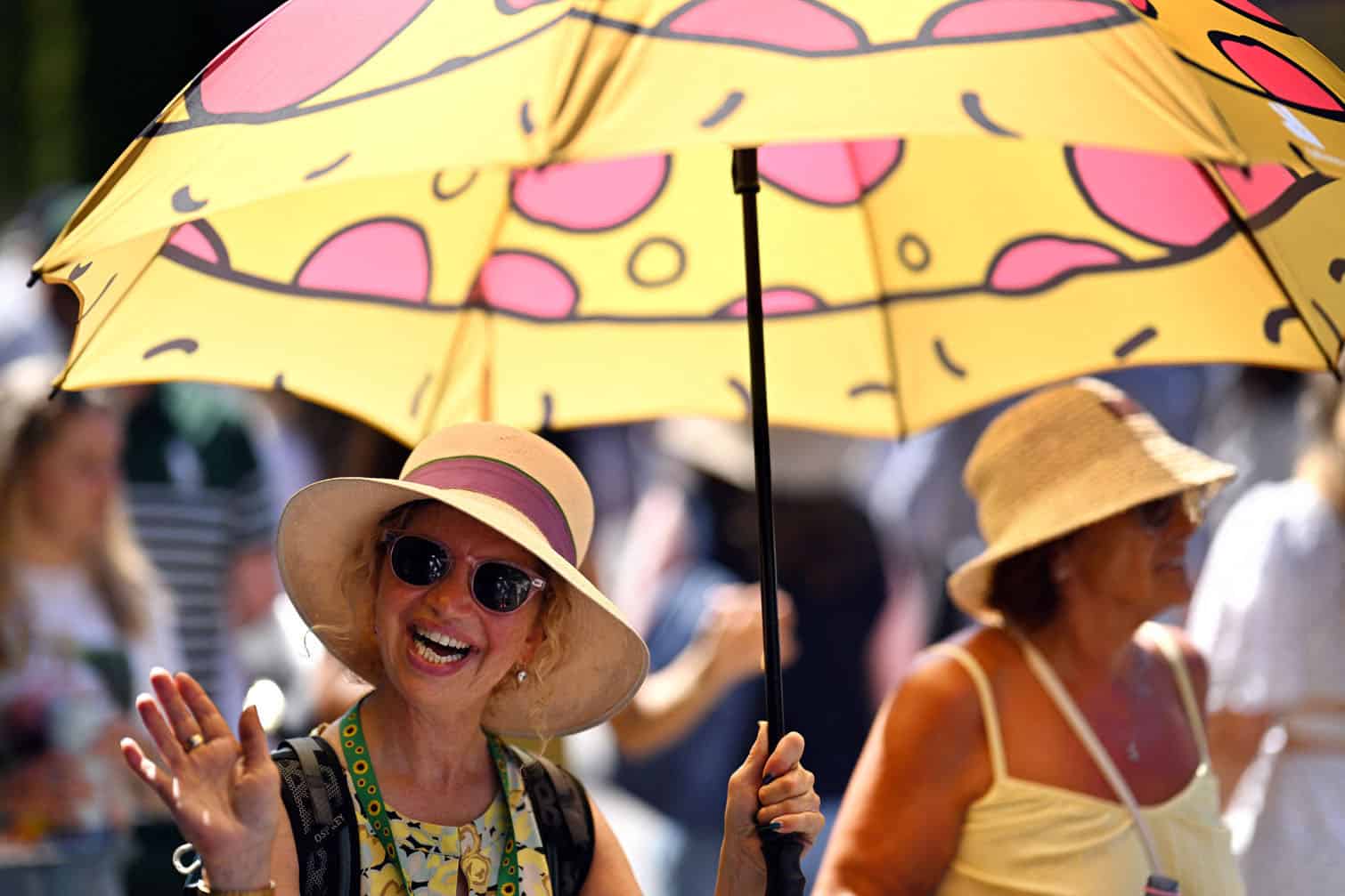 A woman holds an umbrella