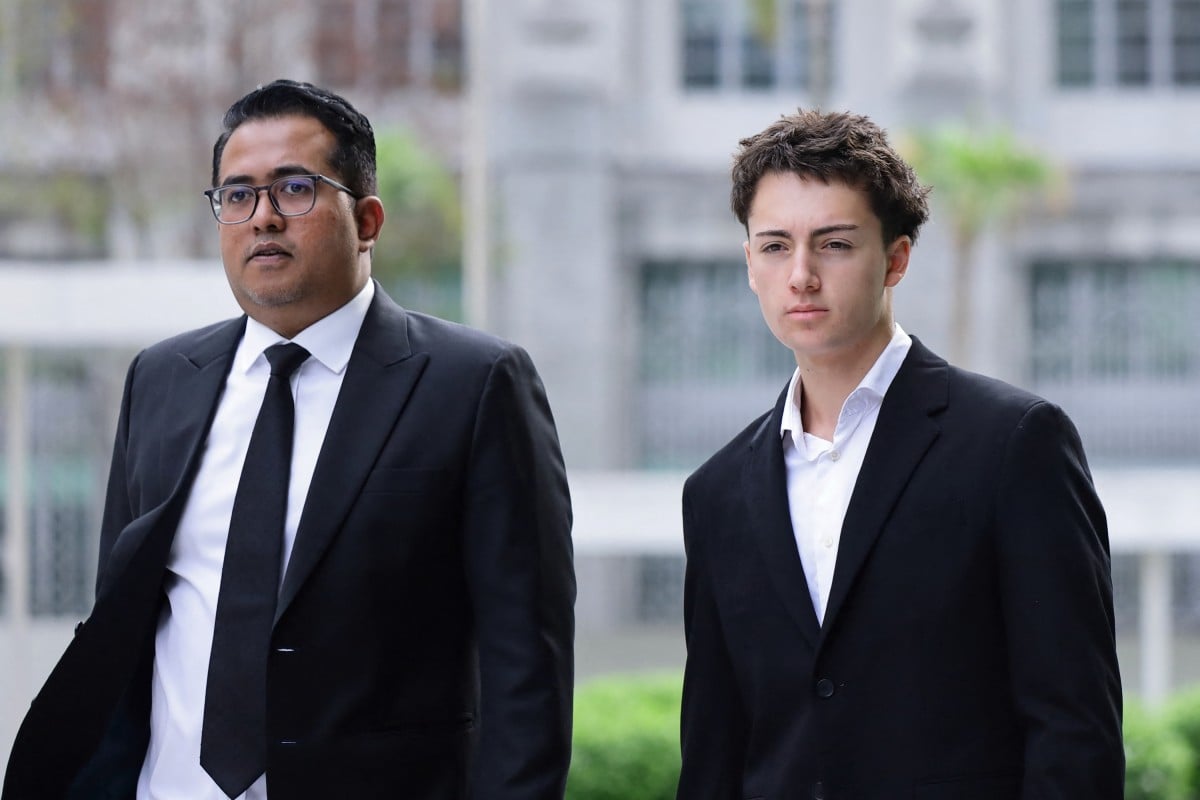 French teenager Didier Gaspard Owen Maximilien arrives at the State Courts in Singapore on July 30, 2026. A French teenager pleaded guilty to a public nuisance charge in Singapore on July 30, for a straw-licking stunt that landed him in hot water in the city-state. Picture via Suhaimi Abdullah / AFP