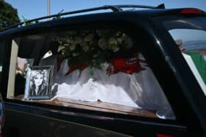 A hearse carrying the coffin of the late singer Bonnie Tyler is driven through her home town of Mumbles, southwest Wales, on 15 August 2026. Welsh singer Bonnie Tyler, best known for her powerful, haunting love song 'Total Eclipse of the Heart' died in Portugal on 8 July 2026, aged 75. Piture: Justin Tallis / AFP