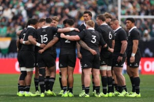 All Blacks rugby players in a huddle