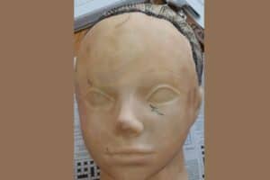 Woman arrested at airport with R300 000 cocaine hidden in doll head