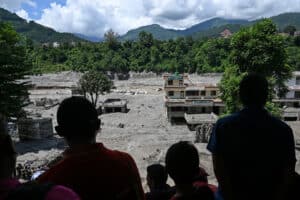 Aid efforts trickle in after deadly Nepal-Tibet floods