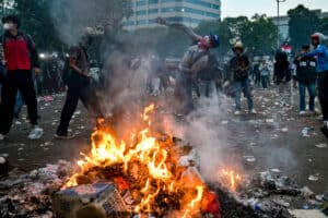 A protester throws a projectile