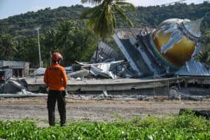 a collapsed mosque following a 7.7-magnitude earthquake