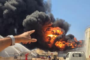 Black smoke rises during a fire at the Zawiya refinery