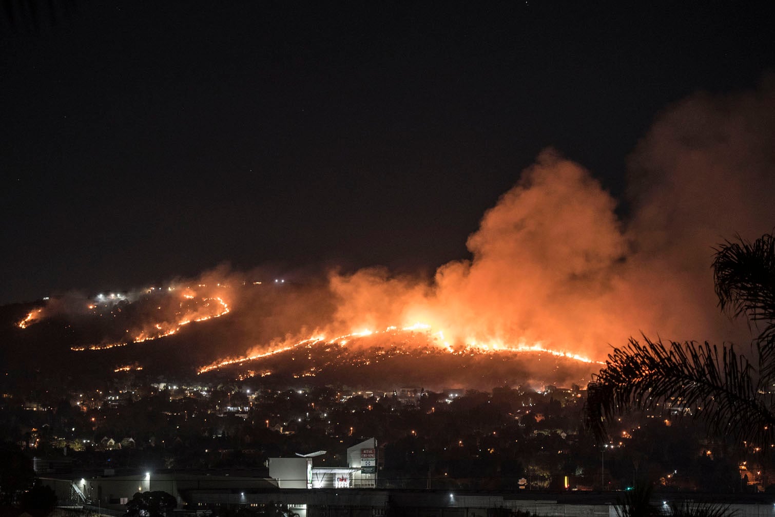 A veld fire is seen burning across the hills in Little Falls, Roodepoort, 23 August 2026. Picture: Michel Bega/The Citizen