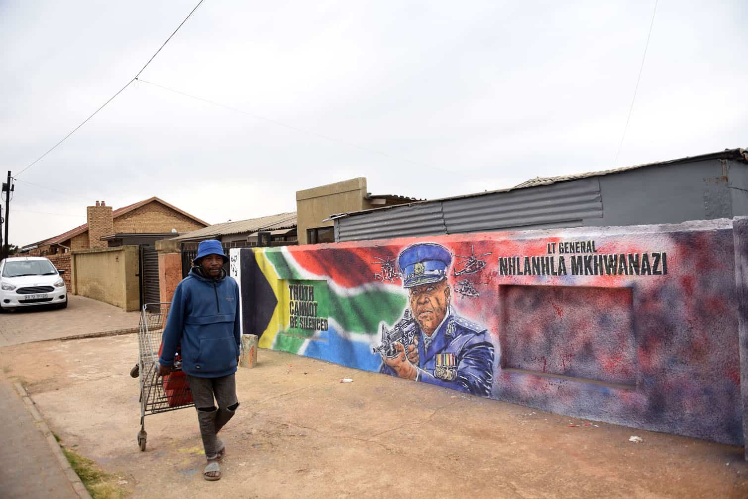 Naledi resident Tumelo Seshabela walks past a mural of Nhlanhla Mkhwanazi along Lekgwale Street in Soweto on 10 August 2026. Johannesburg has a vibrant street art scene, with large murals across the inner city and townships. Picture: Nigel Sibanda / The Citizen