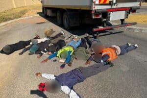 The 9 suspects shortly after being arrested.