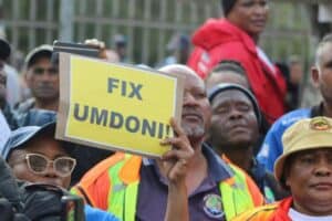 Umdoni residents and workers protest outside the municipality.