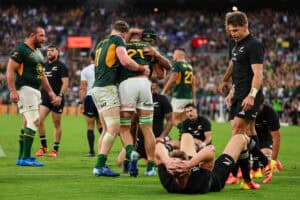 Rugby players from South Africa and New Zealand on the field