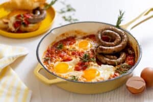 Vetkoek with Boerewors and Tomato Smoor Fried Eggs