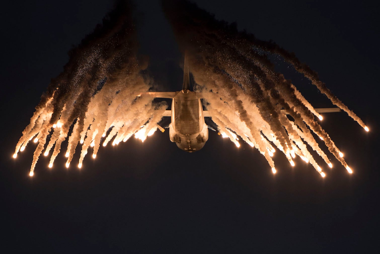 A Lockheed C-130 Hercules fires off flares at the Africa Aerospace and Defence (AAD) 2026 expo, 19 September 2026, at Air Force Base Waterkloof in Centurion. The expo serves as Africa's premier aerospace and defense exhibition, showcasing air, land, and sea technologies. Saturday and Sunday featured a public airshow including gripen and hawk jets, as well as the Roovalk helicopter, among others. Picture: Michel Bega/The Citizen