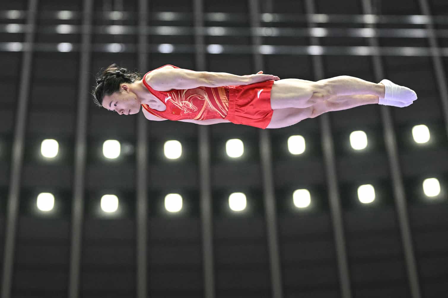 China's Yan Langyu competes in the final of the men's trampoline gymnastics event during the 2026 Asian Games at the Nagoya City General Gymnasium in Nagoya, Aichi prefecture on September 27, 2026. (Photo by MOHD RASFAN / AFP)
