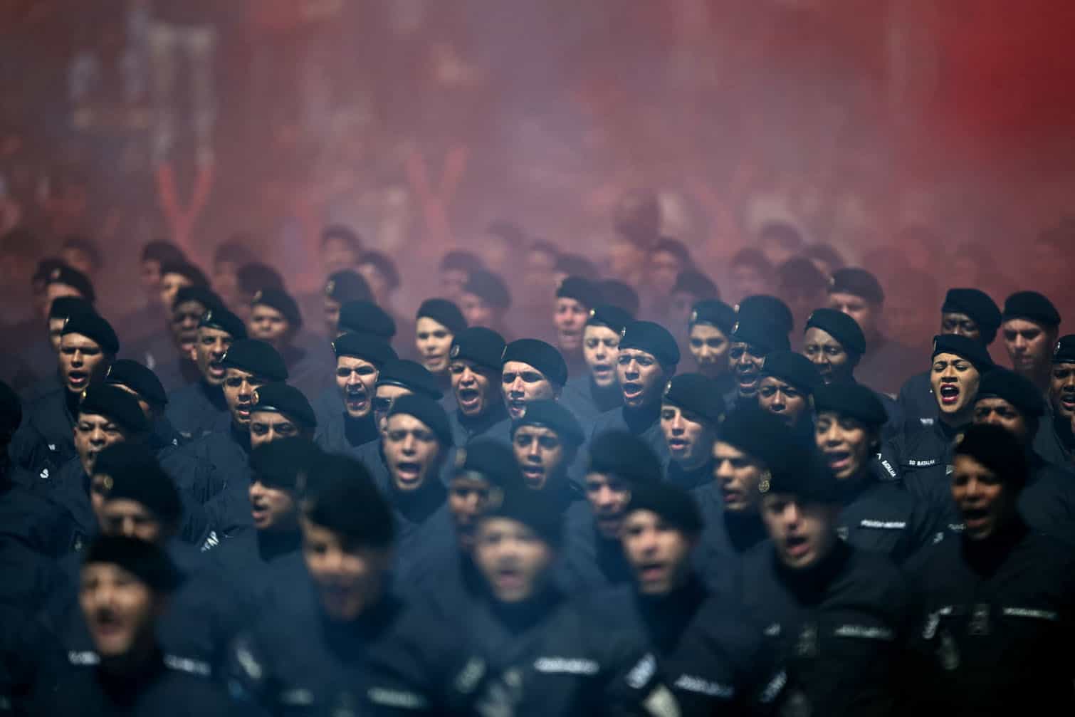 Military police officers march during a graduation ceremony at the Center of Improvement and Training of Soldiers (CFAP) at Sulacap neighbourhood in Rio de Janeiro, Brazil, on September 25, 2026. (Photo by MAURO PIMENTEL / AFP)