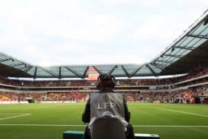 Cameraman at a football match