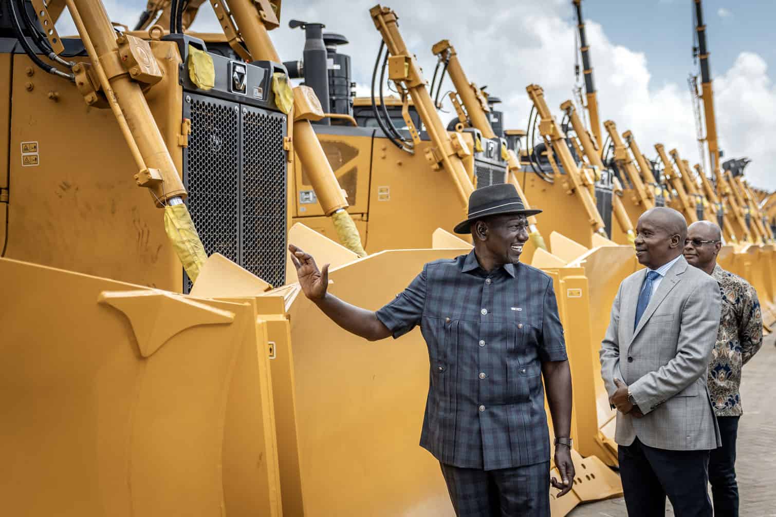Kenya’s President William Ruto (C) and Kenya’s Deputy President Kithure Kindiki (R) inspect excavators and other heavy machinery parked during the groundbreaking ceremony of the Dangote East Africa Petroleum Refinery at Lamu Port in Kililana, Lamu West, on September 30, 2026. Africa's richest broke ground on a new $16-billion mega-refinery in Kenya on Wednesday, saying it marked a "new chapter in Africa's industrial journey". 
Aliko Dangote created Africa's biggest oil refinery in his native Nigeria and the east African version at the port of Lamu will have a capacity of 700,000 barrels per day -- larger than any in Europe.  
The project, which aims for completion within 30 to 40 months, has already faced a lawsuit from a local community over land rights. A court ruling published on Monday said the ground-breaking could go ahead, but the case will continue. (Photo by Luis TATO / AFP)