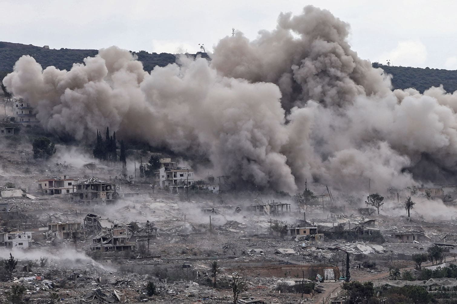 This photograph taken from the southern Lebanese village of Hanniyeh shows smoke rising from the site of a series of Israeli controlled explosions in the nearby village of al-Mansouri on September 28, 2026. Violence declined following a June framework agreement between Lebanon and Israel and a wider US-Iran deal, but Israel has continued to carry out attacks on its northern neighbour. (Photo by Kawnat HAJU / AFP)