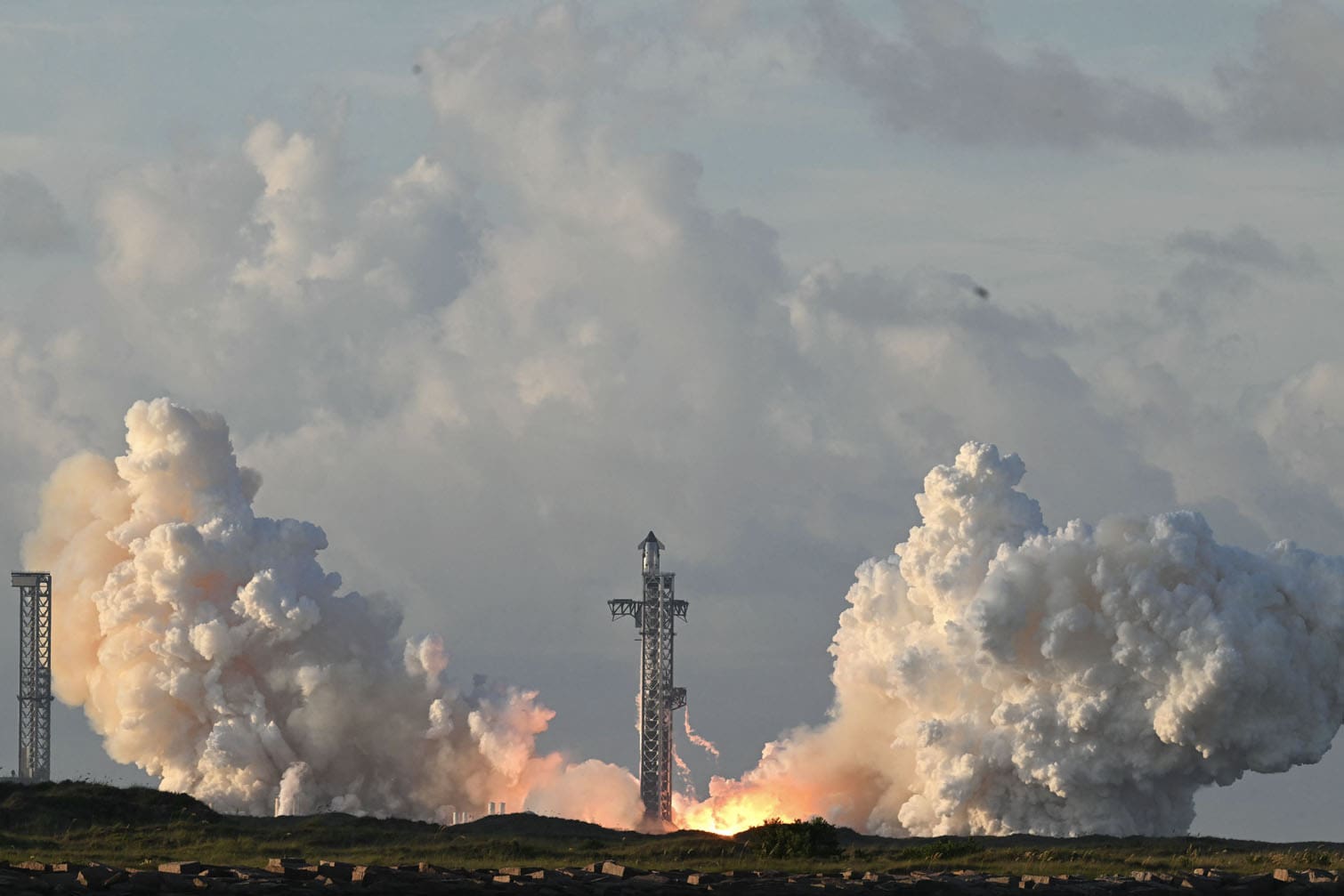 SpaceX Starship Flight 14 launches at SpaceX Starbase in Starbase, Texas on September 28, 2026. Flight 14 is planned to be the first to send Starship into orbit around the Earth as well as deploy Starlink satellites. (Photo by RONALDO SCHEMIDT / AFP)