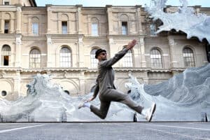 French artist JR poses in front his installation "Diluvium"