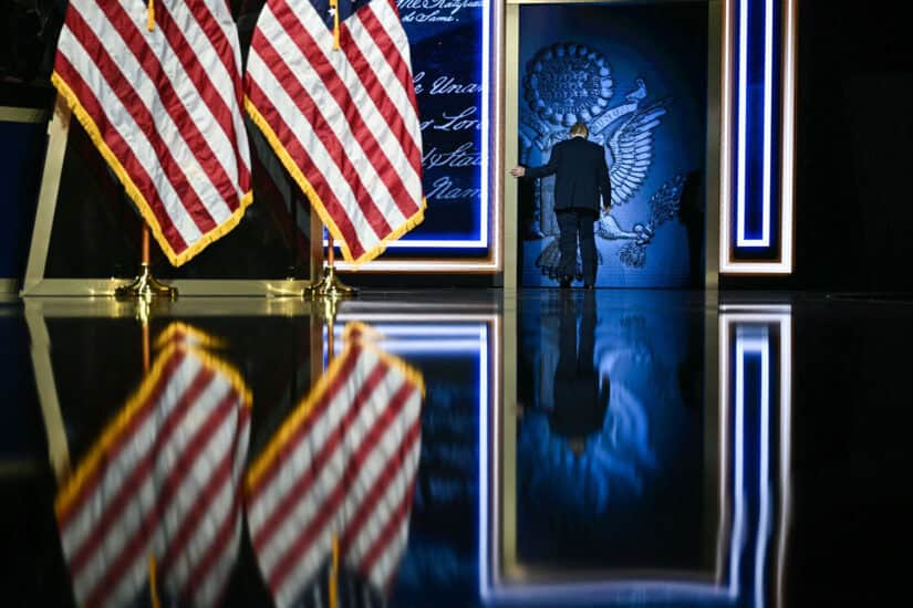 US President Donald Trump departs the stage