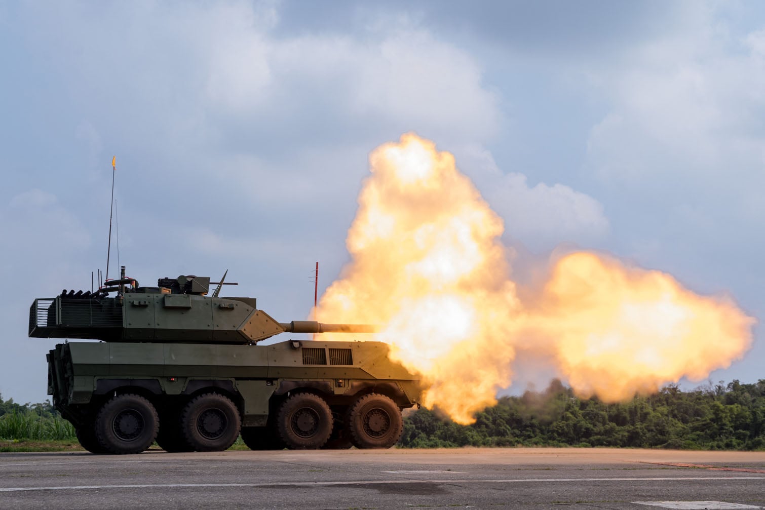 A Taiwan military 105mm wheeled armoured vehicle fires its main gun during a live-fire demonstration in Tainan on September 23, 2026. The domestically developed vehicle, equipped with a 105mm main gun, is currently undergoing operational testing and evaluation. (Photo by CHENG Yu-chen / AFP)