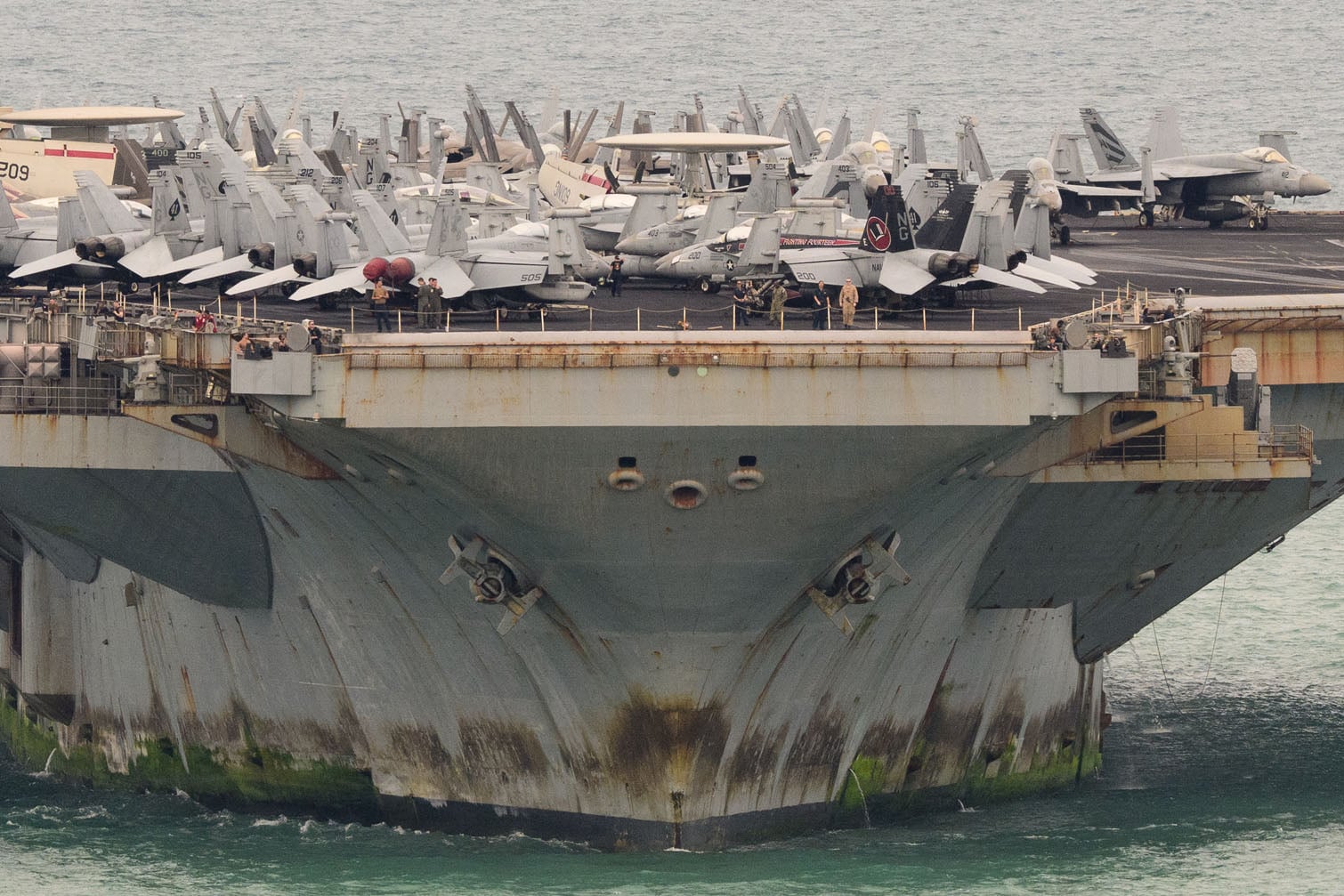 Aircrafts are seen on the flight deck of US nuclear-powered aircraft carrier USS Abraham Lincoln (CVN-72) as it heads towards Laem Chabang Port, near the city of Pattaya on September 2, 2026. (Photo by ANTHONY WALLACE / AFP)