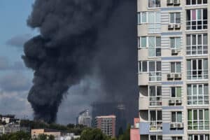 Smoke rises above the city