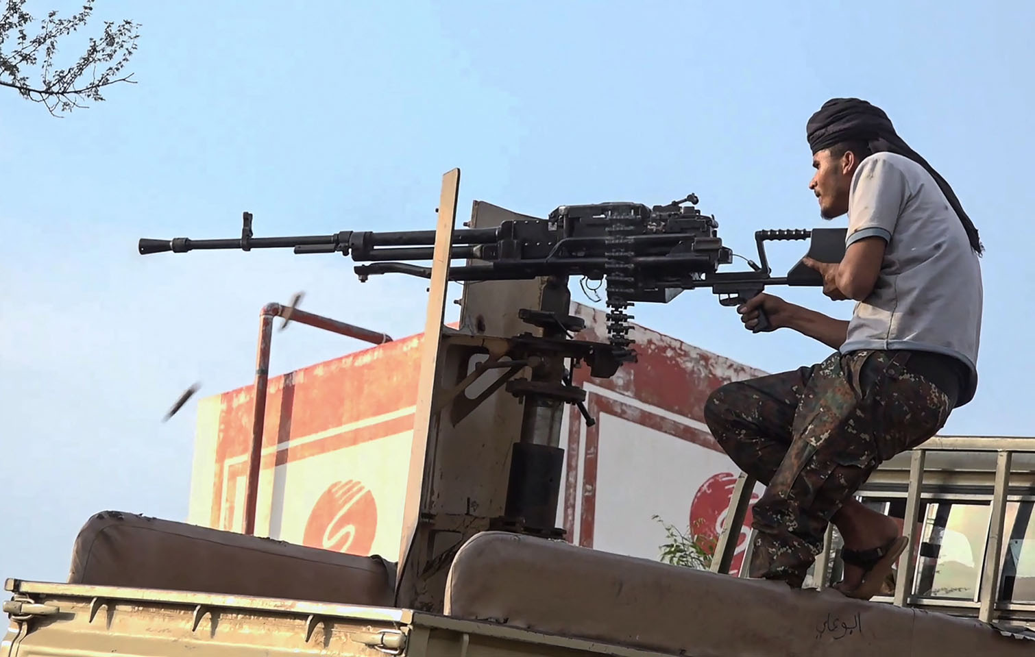 This frame grab taken from AFPTV video footage on September 9, 2026, shows a member of the Saudi-backed Yemeni government forces firing a heavy machine gun during clashes with Houthi fighters in the Al-Kadha area, west of Taiz province, on September 8, 2026. Deadly fighting reignited in Yemen last week, when the Houthis launched a major campaign to seize territory near the Bab al-Mandab strait. The strait has become an increasingly important route for Saudi oil since Iran blockaded the Strait of Hormuz, choking Gulf exports. (Photo by AFPTV / AFP)
