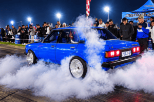 A Toyota Corola doing a burnout