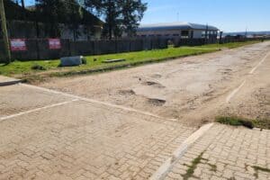 Road with potholes and no streetlighting in Makhanda.
