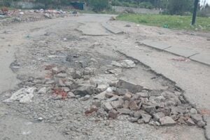 A road riddled with potholes in Mangaung.