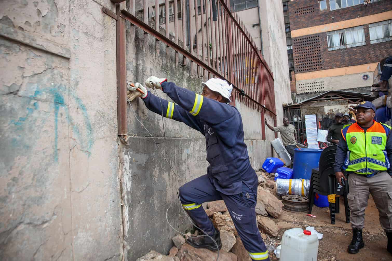 City Power officials target several suspected hijacked buildings in inner city revenue collection drive on October 05, 2026 in Johannesburg, South Africa. The operation is aimed at ensuring that customers settle their outstanding accounts, enabling the entity to recover the revenue required to support electricity infrastructure investment, maintenance and the continued provision of reliable electricity services.  (Photo by Gallo Images/Sharon Seretlo)