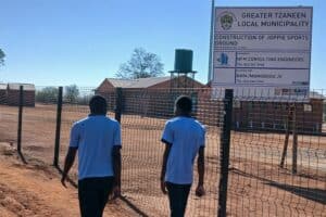 Joppie sports ground in limpopo handover, as students walk passed