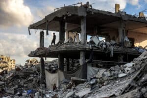 A man stands in a destroyed building in the Jabalia camp