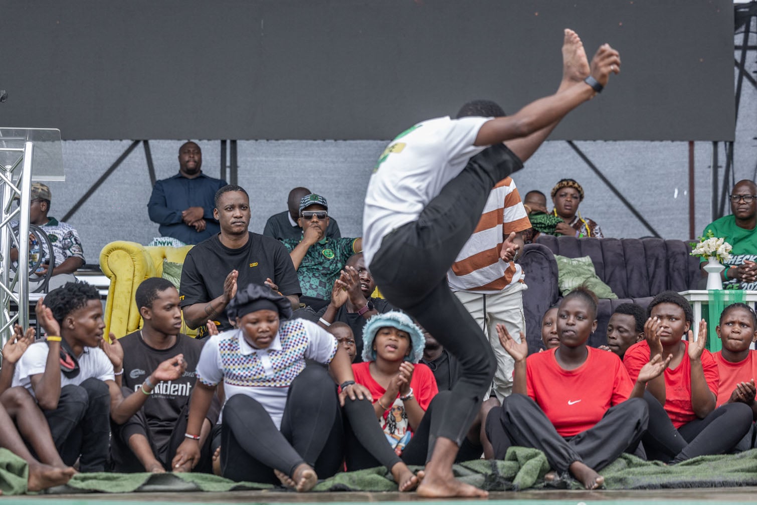 UmKhonto we Sizwe Party's (MKP) First President Duduzane Zuma watches a local group performing a Zulu dance during an election campaign mini rally in Umgababa, south of Durban on October 18, 2026, ahead of the country’s upcoming municipal elections. (Photo by RAJESH JANTILAL / AFP)